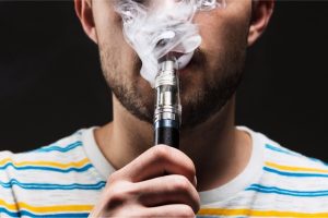 Effective Press Release Templates for Tobacco, Cigarettes, Vapes & Smoking Product Promotions Man exhaling vapor while using an electronic cigarette