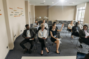 Do Press Releases Have a Byline? Journalists attending a press conference for a corporate news announcement