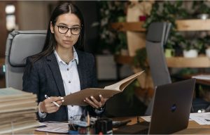 Writing an Earnings Announcement Press Release: Examples, Templates & Best Practices Investor relations professional reviewing financial documents before finalizing an earnings announcement.