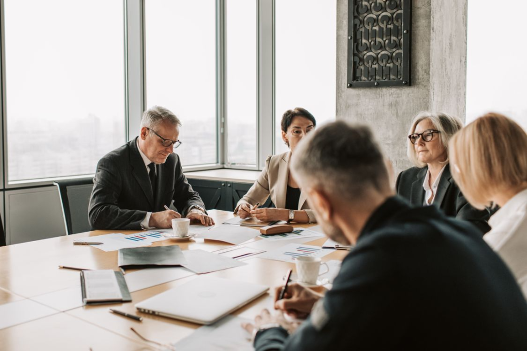 Executive team reviewing financial reports before an earnings announcement.